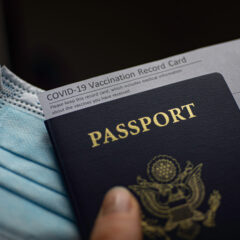 Blurred,Covid-19,Vaccination,Record,Card,,Passport,Of,Usa,And,Medical